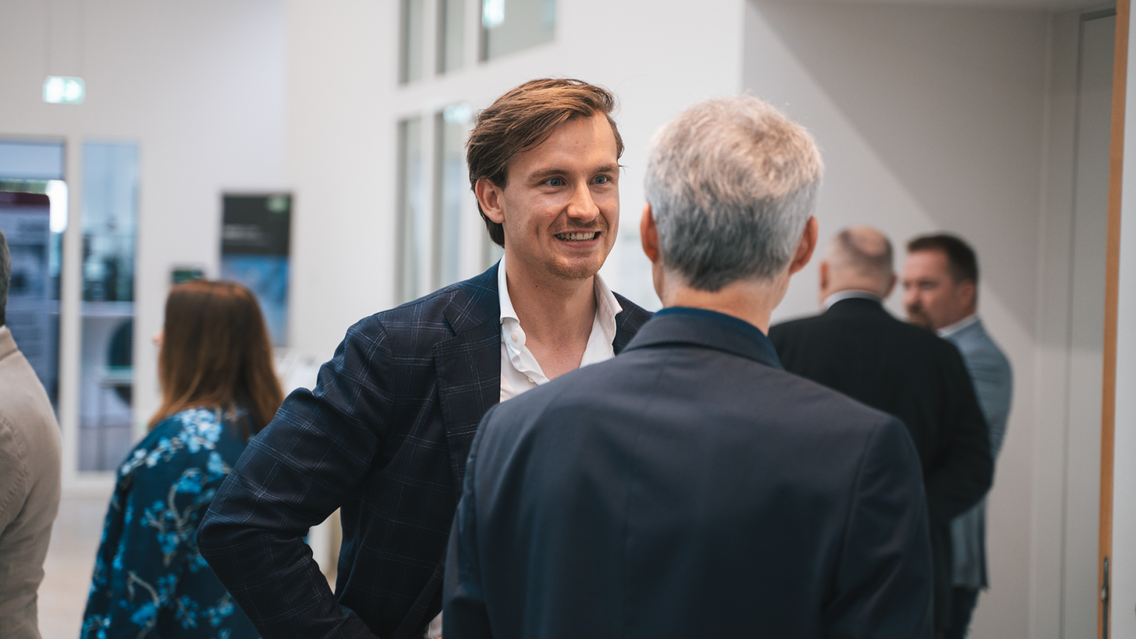 Two person talking at the IRN conference